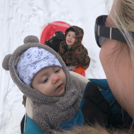Mother and two children in the snow