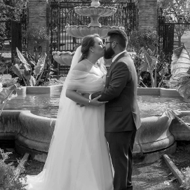 Bride and groom infront of fountain